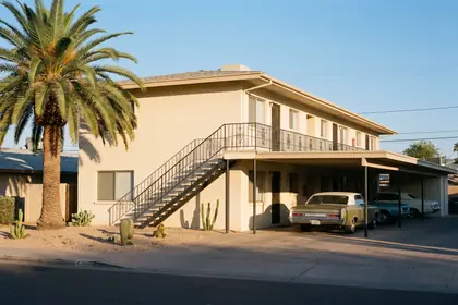 7220 N 56th Ave — two-storey walk-up elevation with an exterior stair