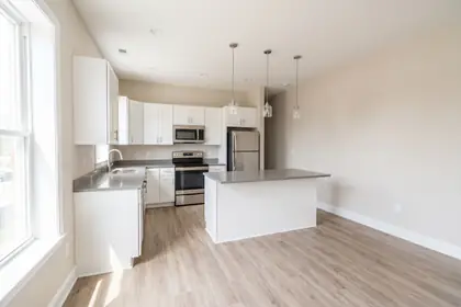 2044 S Sycamore — renovated kitchen with quartz counters and vinyl plank flooring
