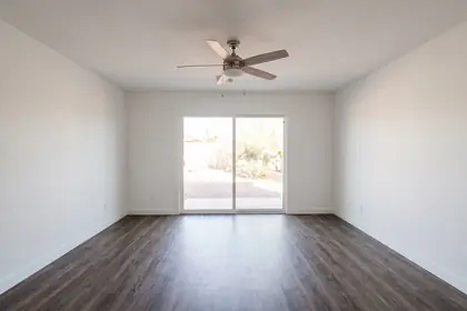 2044 S Sycamore — vacant living area with vinyl plank flooring and a slider to the patio